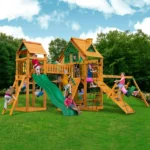 Gorilla Playsets Pioneer Peak Treehouse Wooden Swing Set with Tire Swing, and Clatter Bridge and Tower - Image 2